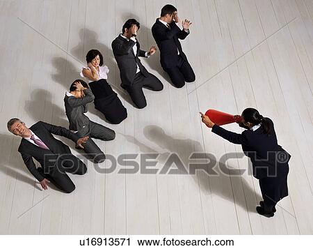 Stock Image - Business woman shouting at colleges. Fotosearch