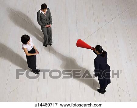 Business woman shouting at women View Large Photo Image Stock Photo - Business woman shouting at women. Fotosearch