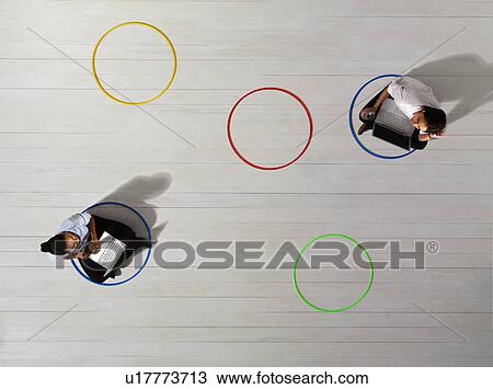 Business women in circles with laptops View Large Photo Image Stock Image - Business women in circles with laptops. Fotosearch