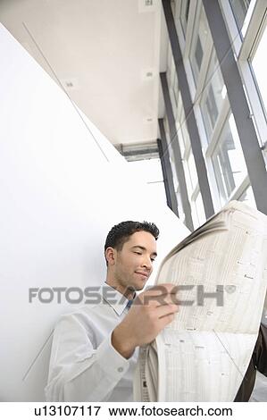 Businessman is reading good news View Large Photo Image Stock Photo - Businessman is reading good news. Fotosearch