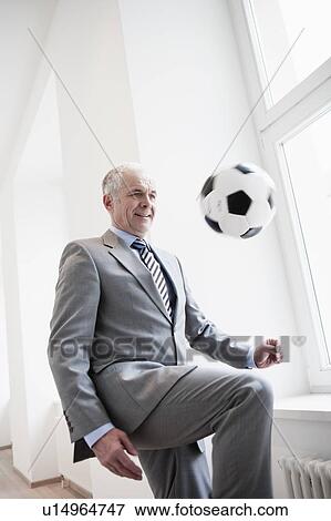 Businessman playing soccer View Large Photo Image Stock Photo - Businessman playing soccer. Fotosearch