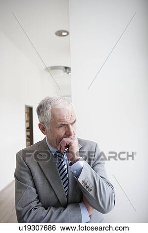 Stock Photograph - Businessman pondering. Fotosearch