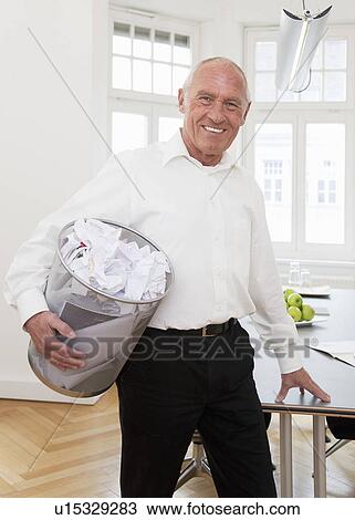 Businessman recycling waste paper View Large Photo Image Stock Image - Businessman recycling waste paper. Fotosearch