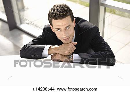 Businessman resting, smiling View Large Photo Image Picture - Businessman resting, smiling. Fotosearch