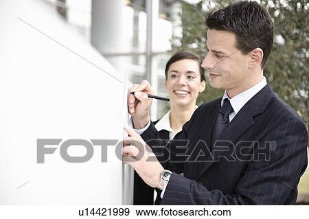 Stock Photo - Businessman signing document. Fotosearch