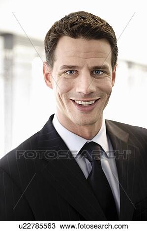 Businessman smiling, portrait View Large Photo Image Stock Image - Businessman smiling, portrait. Fotosearch
