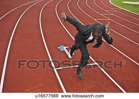 businessman sprinting on running track View Large Photo Image Stock Photo - businessman sprinting on running track. Fotosearch