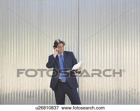 Stock Photo - Businessman talking on the phone. Fotosearch