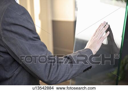Businessman using touchscreen View Large Photo Image Picture - Businessman using touchscreen. Fotosearch