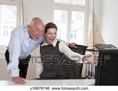 Stock Photograph - Businesspeople laughing. Fotosearch