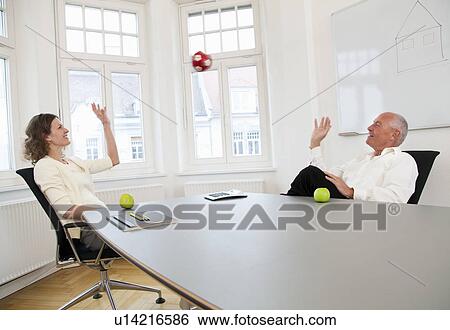 Businesspeople relaxing on a break View Large Photo Image Stock Photograph - Businesspeople relaxing on a break. Fotosearch