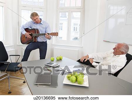 Stock Photography - Businesspeople relaxing on a break. Fotosearch