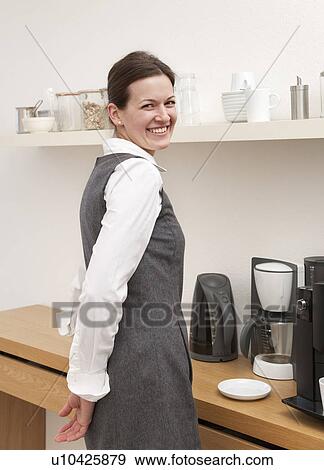Businesswoman in coffee kitchen View Large Photo Image Stock Photo - Businesswoman in coffee kitchen. Fotosearch