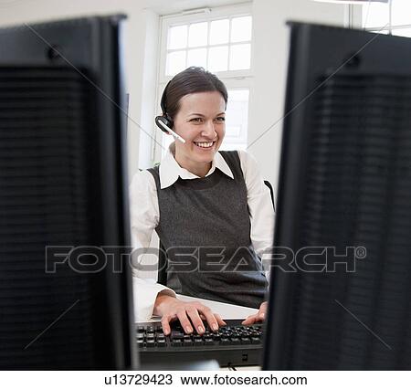 Businesswoman in front of computer View Large Photo Image Stock Image - Businesswoman in front of computer. Fotosearch