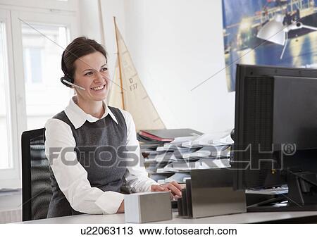 Businesswoman in front of computer View Large Photo Image Stock Image - Businesswoman in front of computer. Fotosearch