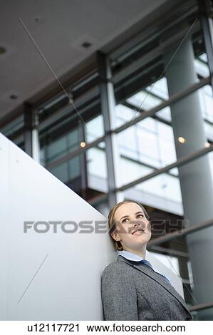 Stock Image - Businesswoman is dreaming in a break. Fotosearch