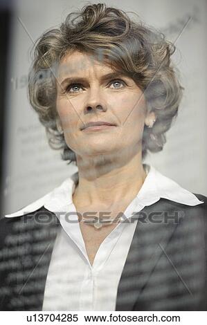 Businesswoman looking out window View Large Photo Image Stock Photography - Businesswoman looking out window. Fotosearch