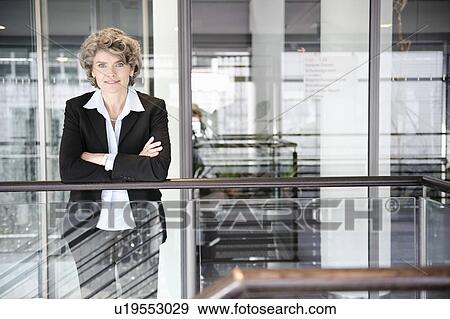 Stock Photo - Businesswoman smiling, portrait. Fotosearch