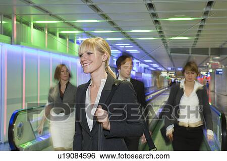 Stock Photograph - businesswoman waiting, happy. Fotosearch