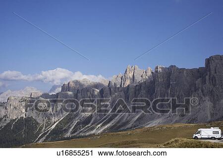 Stock Image - Camper van in mountains. Fotosearch