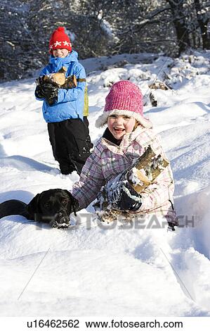 Children and dog collecting wood in snow View Large Photo Image Stock Image - Children and dog collecting wood in snow. Fotosearch