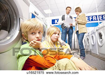 Children are bored of washing machines View Large Photo Image Stock Photography - Children are bored of washing machines. Fotosearch