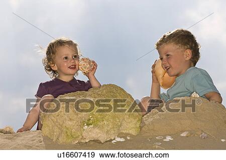 Children at the beach View Large Photo Image Stock Photo - Children at the beach. Fotosearch