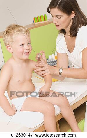 Children at the pediatrician View Large Photo Image Stock Photo - Children at the pediatrician. Fotosearch