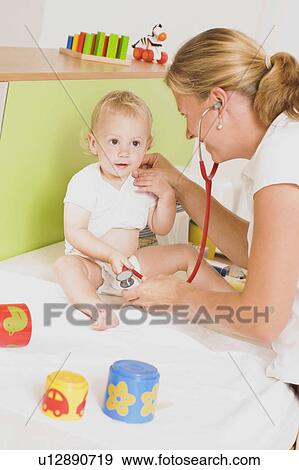 Stock Photo - Children at the pediatrician. Fotosearch
