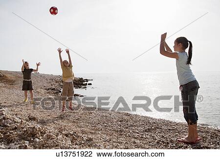 Children playing ball at the beach View Large Photo Image Stock Image - Children playing ball at the beach. Fotosearch