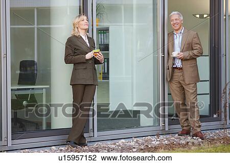 Stock Image - Coffee break outside the office. Fotosearch