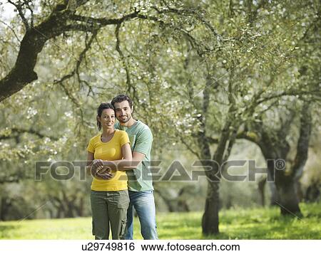 Couple hugging in countryside View Large Photo Image Stock Photograph - Couple hugging in countryside. Fotosearch