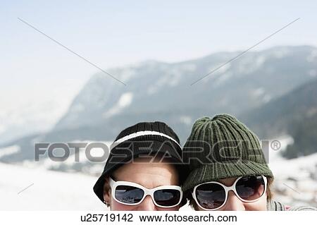 Couple in alps looking to camera View Large Photo Image Stock Image - Couple in alps looking to camera. Fotosearch