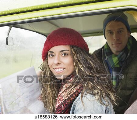 Couple in camper van looking at map View Large Photo Image Stock Photograph - Couple in camper van looking at map. Fotosearch