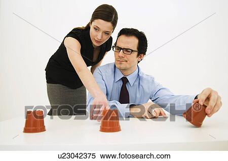 Couple looking for hidden item View Large Photo Image Stock Photography - Couple looking for hidden item. Fotosearch