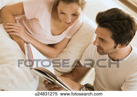 Couple reading a book View Large Photo Image Stock Photography - Couple reading a book. Fotosearch