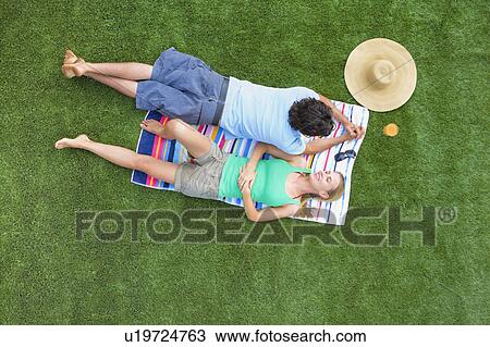 Couple resting in a garden View Large Photo Image Stock Image - Couple resting in a garden. Fotosearch