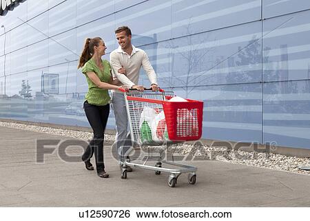 Couple shopping View Large Photo Image Stock Photograph - Couple shopping. Fotosearch