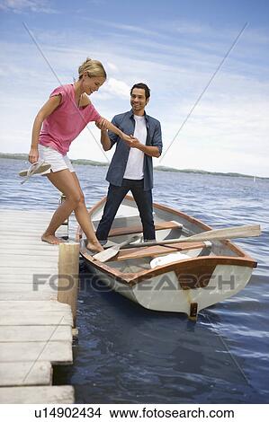 Couple starting a boat trip View Large Photo Image Picture - Couple starting a boat trip. Fotosearch