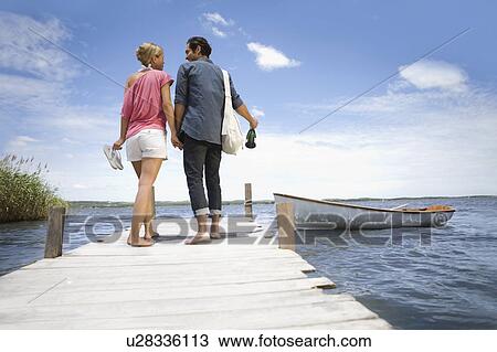 Couple starting a boat trip View Large Photo Image Stock Image - Couple starting a boat trip. Fotosearch