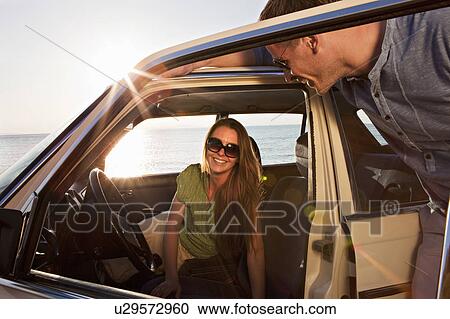 Couple with oldtimer by sea View Large Photo Image Stock Image - Couple with oldtimer by sea. Fotosearch