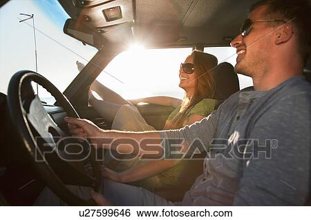 Couple with oldtimer by sea View Large Photo Image Stock Photograph - Couple with oldtimer by sea. Fotosearch