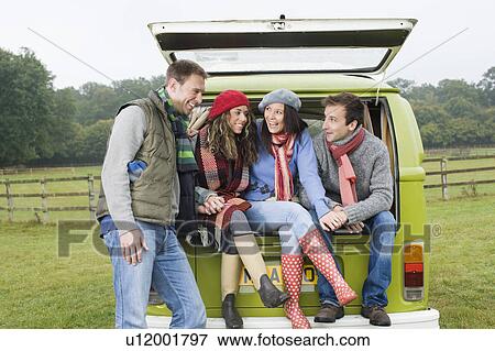 Couples at back of camper van View Large Photo Image Stock Photo - Couples at back of camper van. Fotosearch
