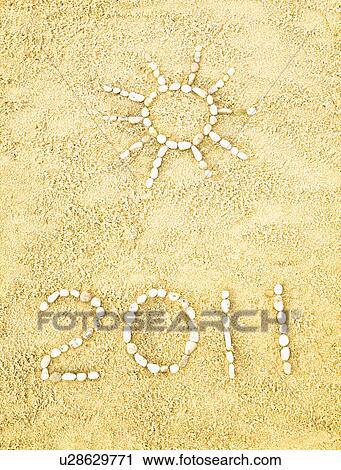 Stock Image - Date and sun in sand. Fotosearch