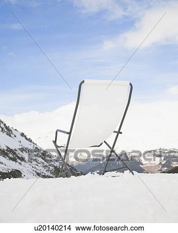 Deck chair overlooking mountain scene View Large Photo Image Picture - Deck chair overlooking mountain scene. Fotosearch
