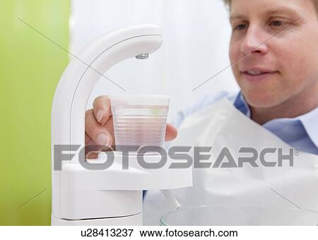 Stock Photo - Dental patient in surgery. Fotosearch