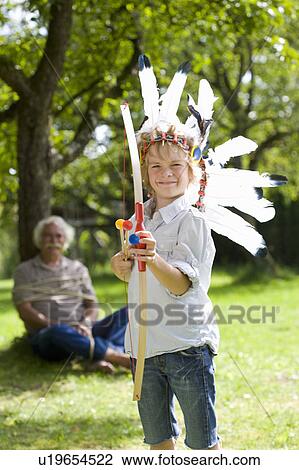Disguised boy with toy bow and arrows View Large Photo Image Stock Image - Disguised boy with toy bow and arrows. Fotosearch