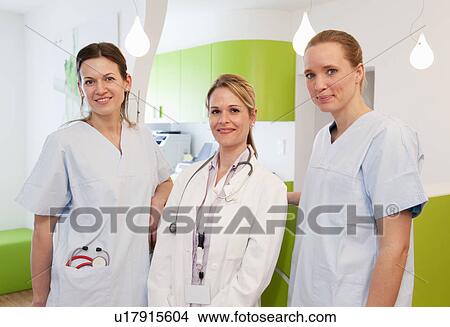 Picture - Doctor and nurses in surgery. Fotosearch