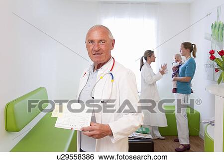 Doctor in surgery View Large Photo Image Stock Photograph - Doctor in surgery. Fotosearch
