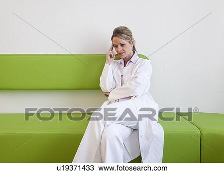 Doctor in surgery waiting area View Large Photo Image Stock Image - Doctor in surgery waiting area. Fotosearch